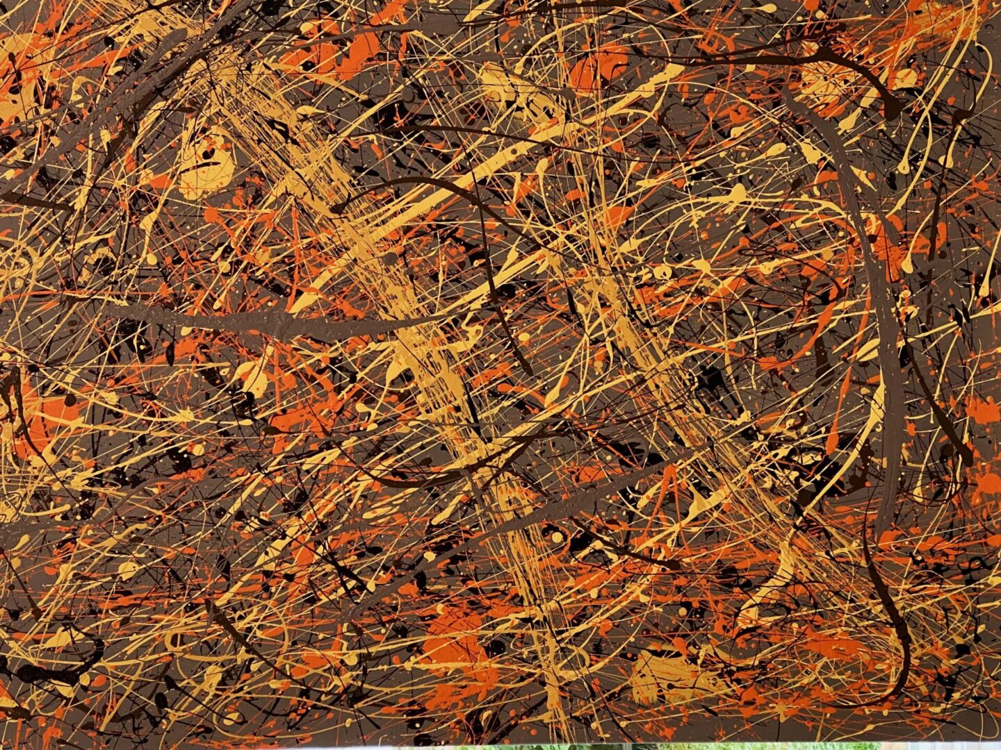 Abstract expressionist painting with chaotic splatters of orange, black, and yellow.