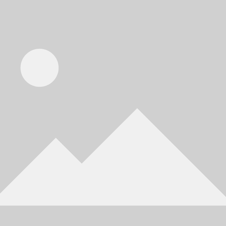 Two people sitting on a bench in a park with a dog beside them.